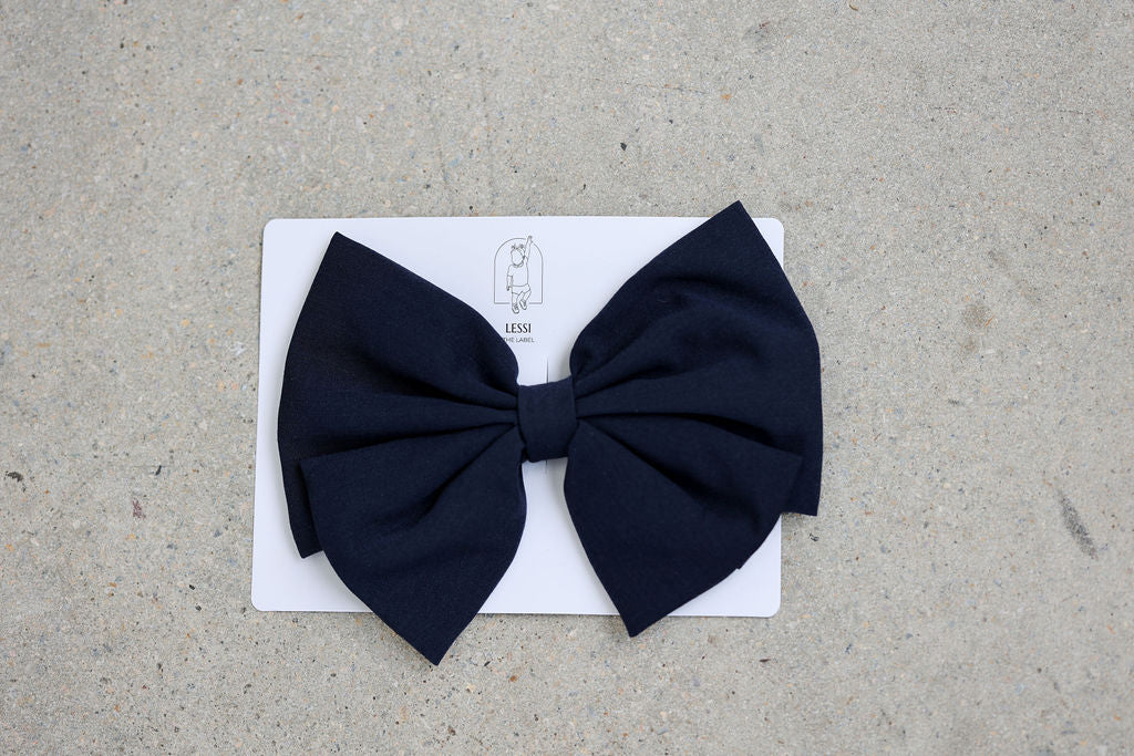 Alessia Bow Bianco by Lessi The Label | Luxurious Kids’ Hair Accessory. Elevate your child’s style with the Alessia Bow Bianco by Lessi The Label—an oversized, high-quality bow available in four timeless colors. Perfect for adding a touch of luxury to any outfit. Enjoy 10% off your first order, free shipping on orders over $100, and worldwide delivery!